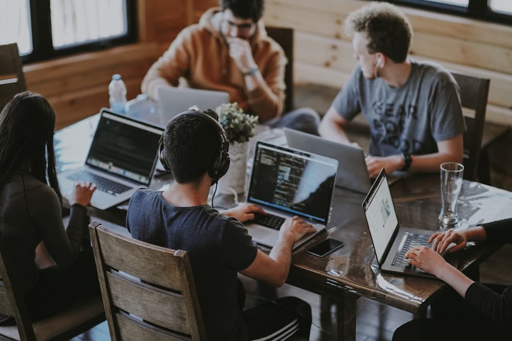 Group of diverse business professionals collaborating in modern office
